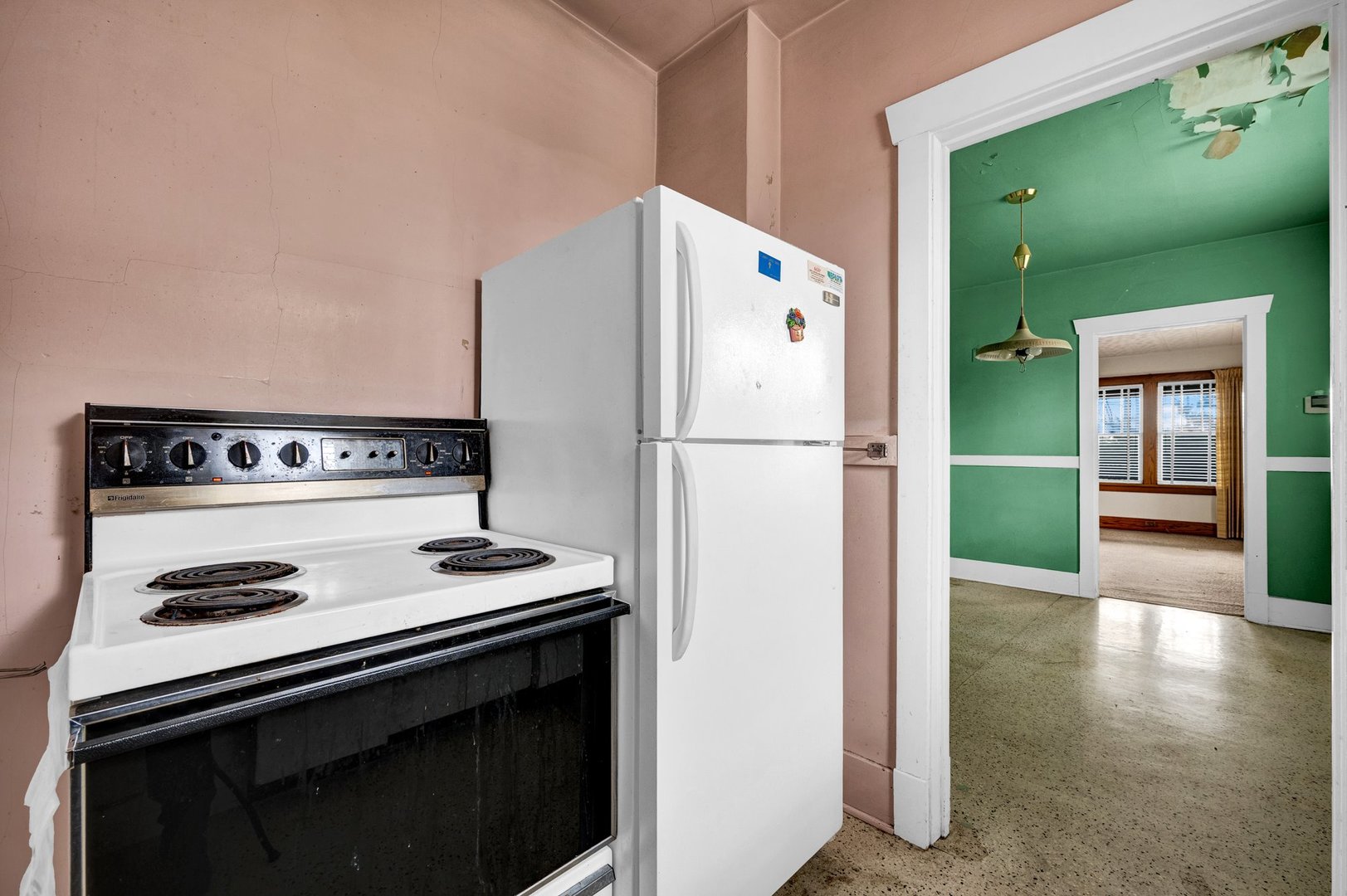 2319 5th Street Peru, IL 61354 - Photo 11 of 37 a kitchen with a stove and a refrigerator