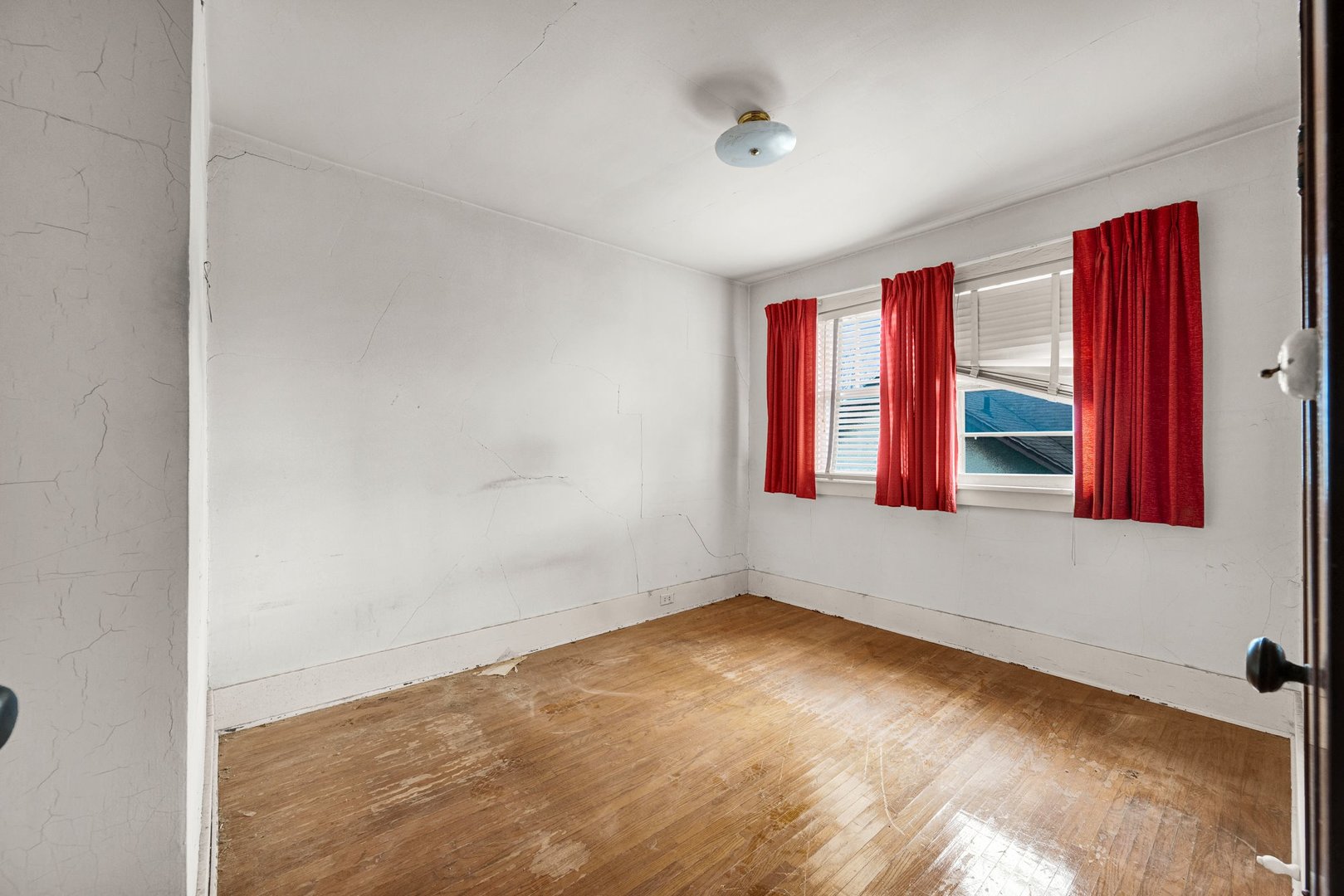 2319 5th Street Peru, IL 61354 - Photo 17 of 37 a view of an empty room with wooden floor and windows