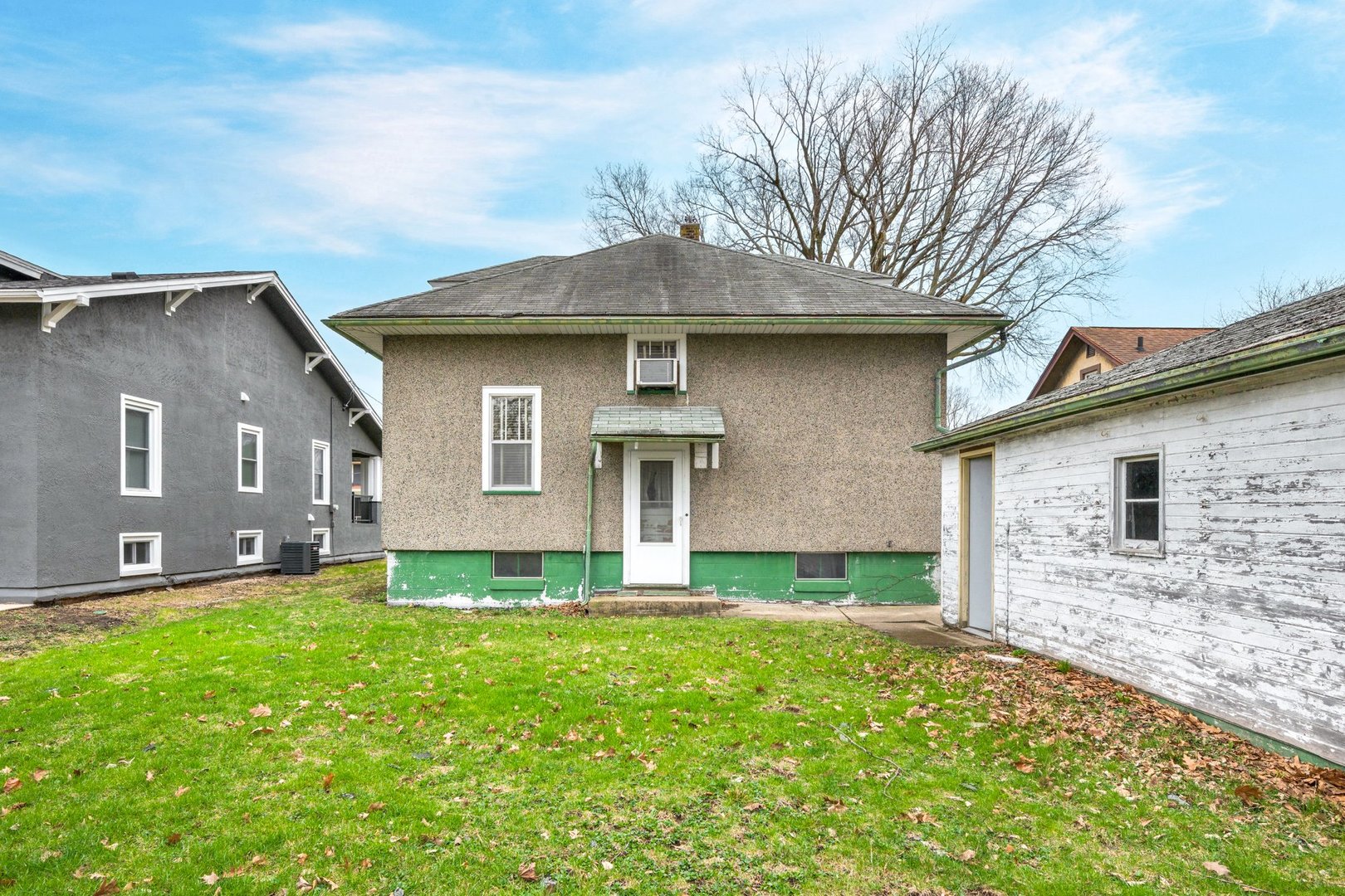 2319 5th Street Peru, IL 61354 - Photo 25 of 37 a front view of house with yard and trees in the background
