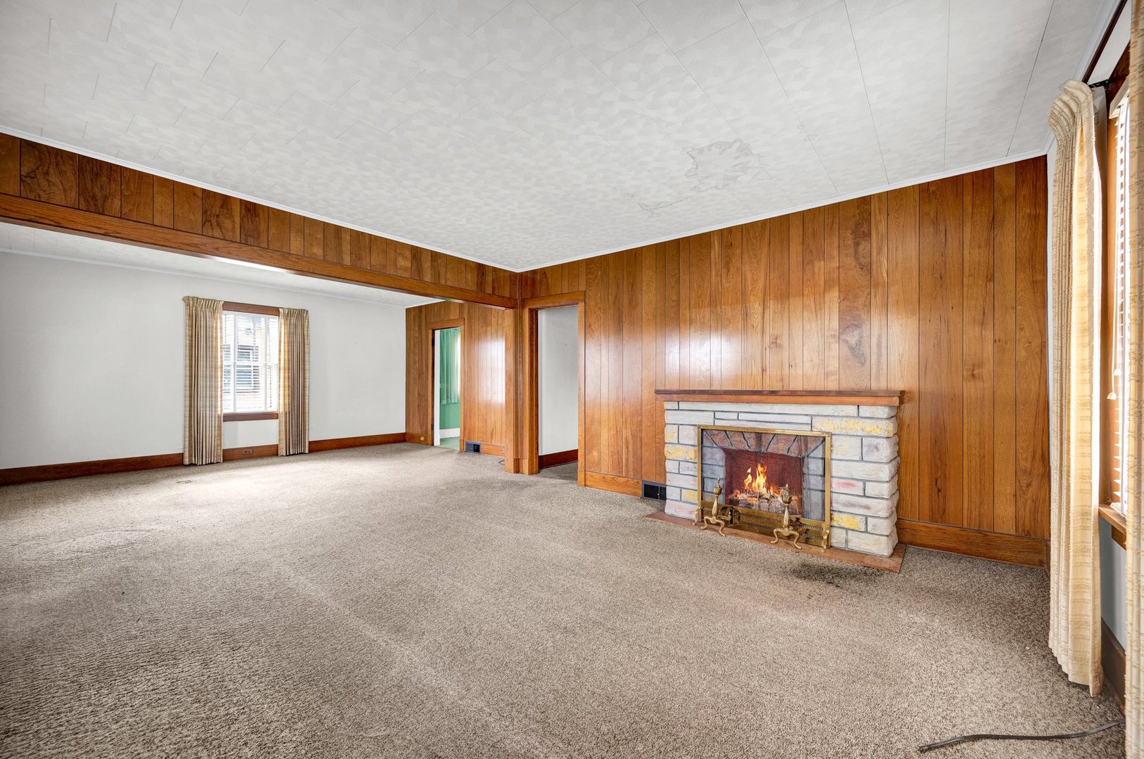 2319 5th Street Peru, IL 61354 - Photo 5 of 37 an empty room with a fireplace and window