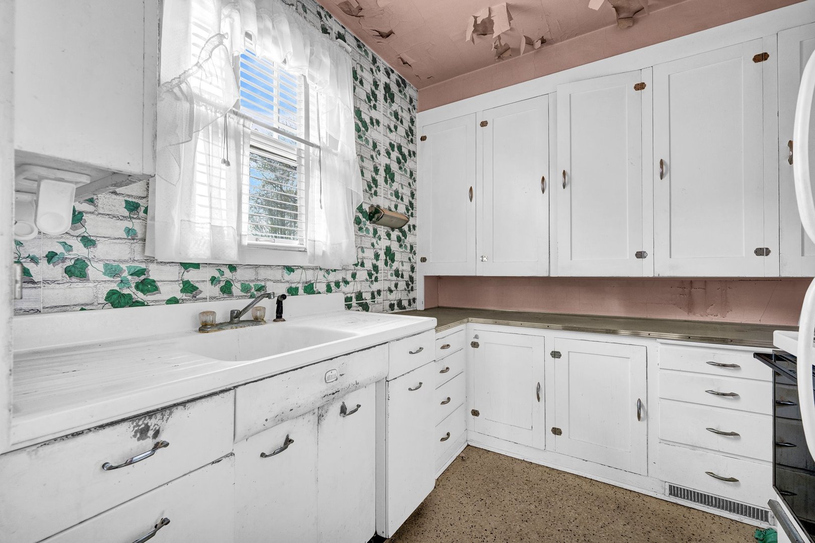 2319 5th Street Peru, IL 61354 - Photo 10 of 37 a view of cabinets a sink and a window