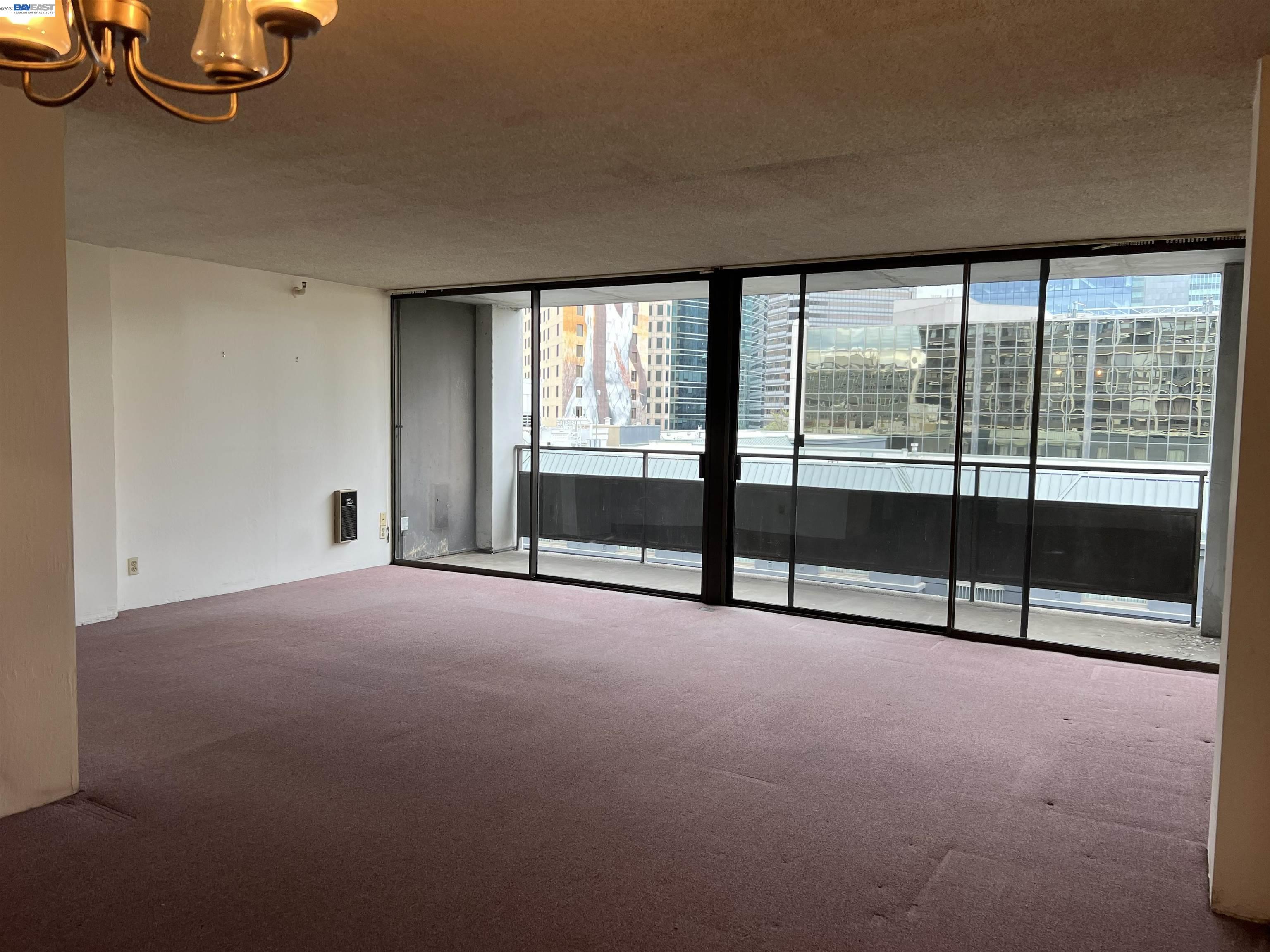 801 Franklin Street, Unit 707 Oakland, CA 94607 - Photo 1 of 14 a view of an empty room with windows