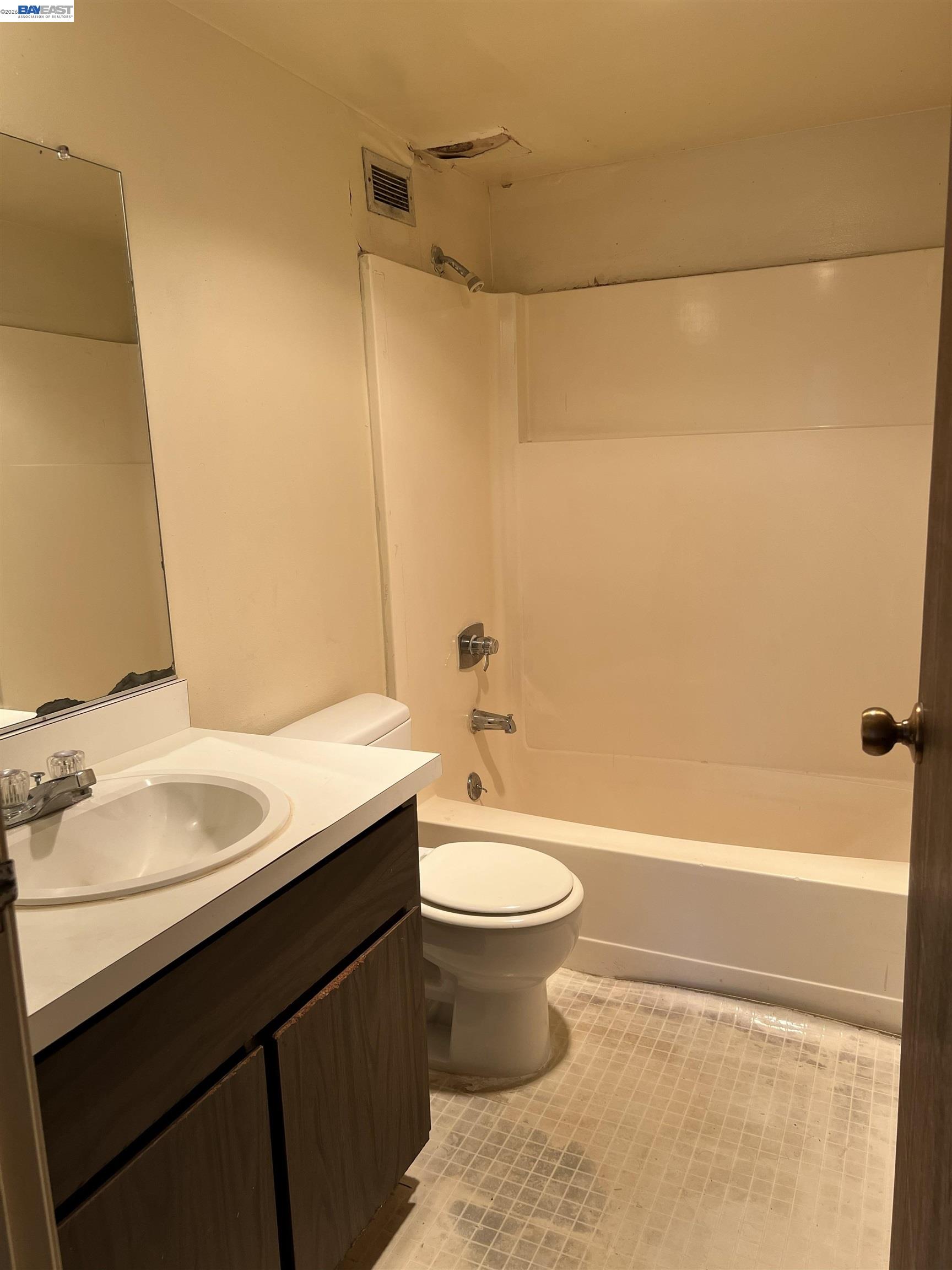 801 Franklin Street, Unit 707 Oakland, CA 94607 - Photo 9 of 14 a bathroom with a sink a toilet and shower