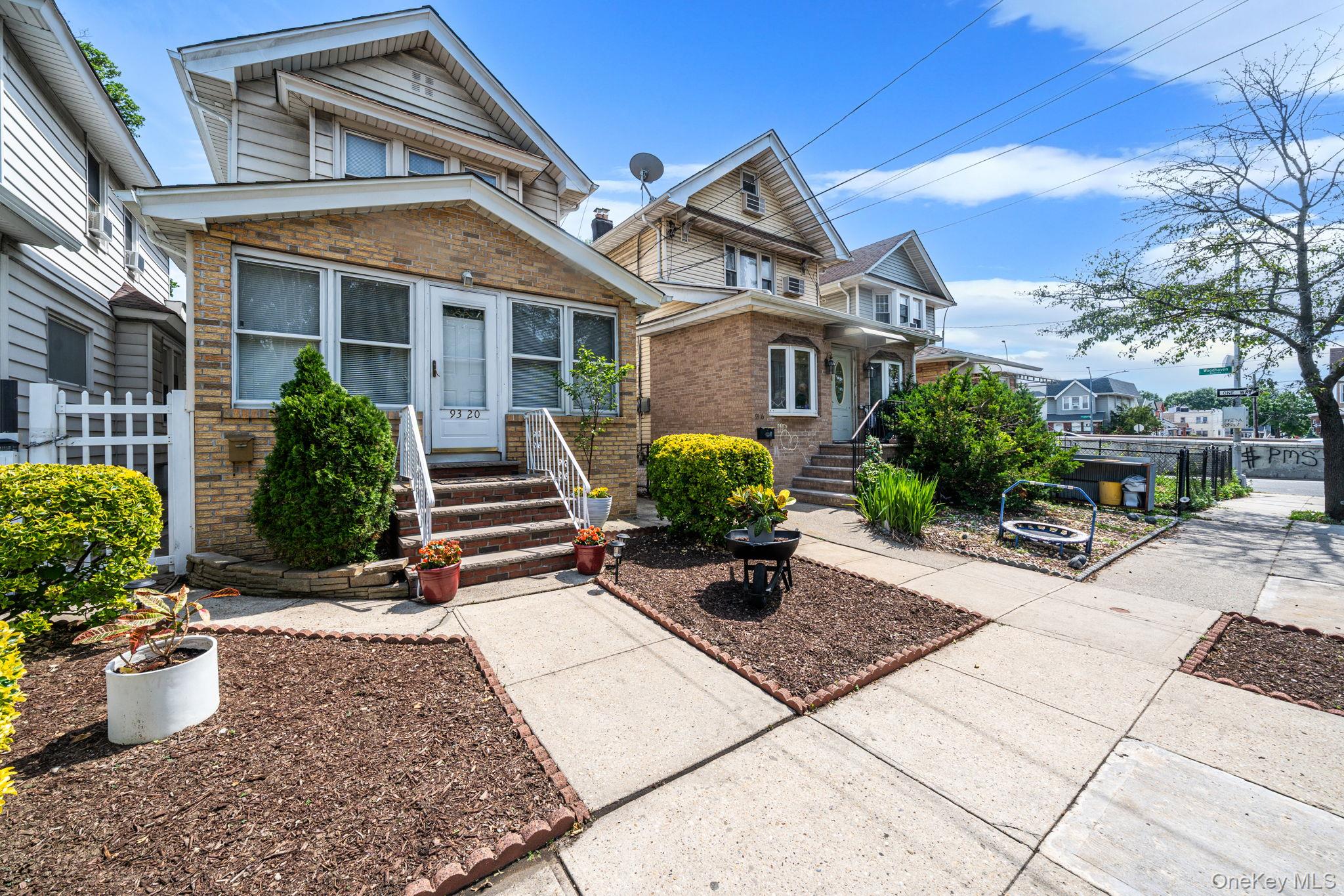 93-20 92nd Avenue Queens, NY 11421 - Photo 2 of 21 a front view of a house with garden