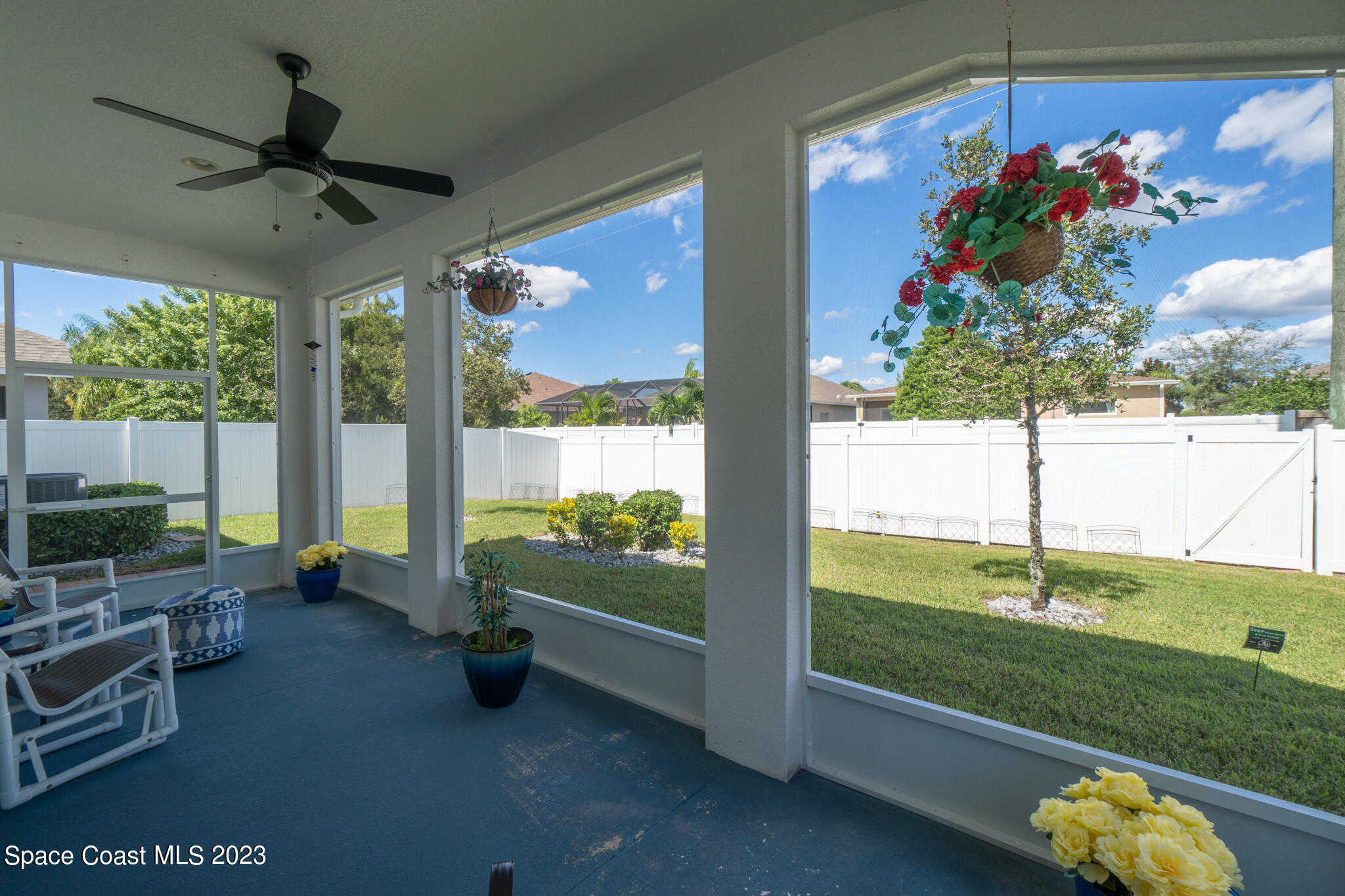 4302 Ruthann Circle Melbourne, FL 32934 - Photo 18 of 45 a living room with furniture and a floor to ceiling window
