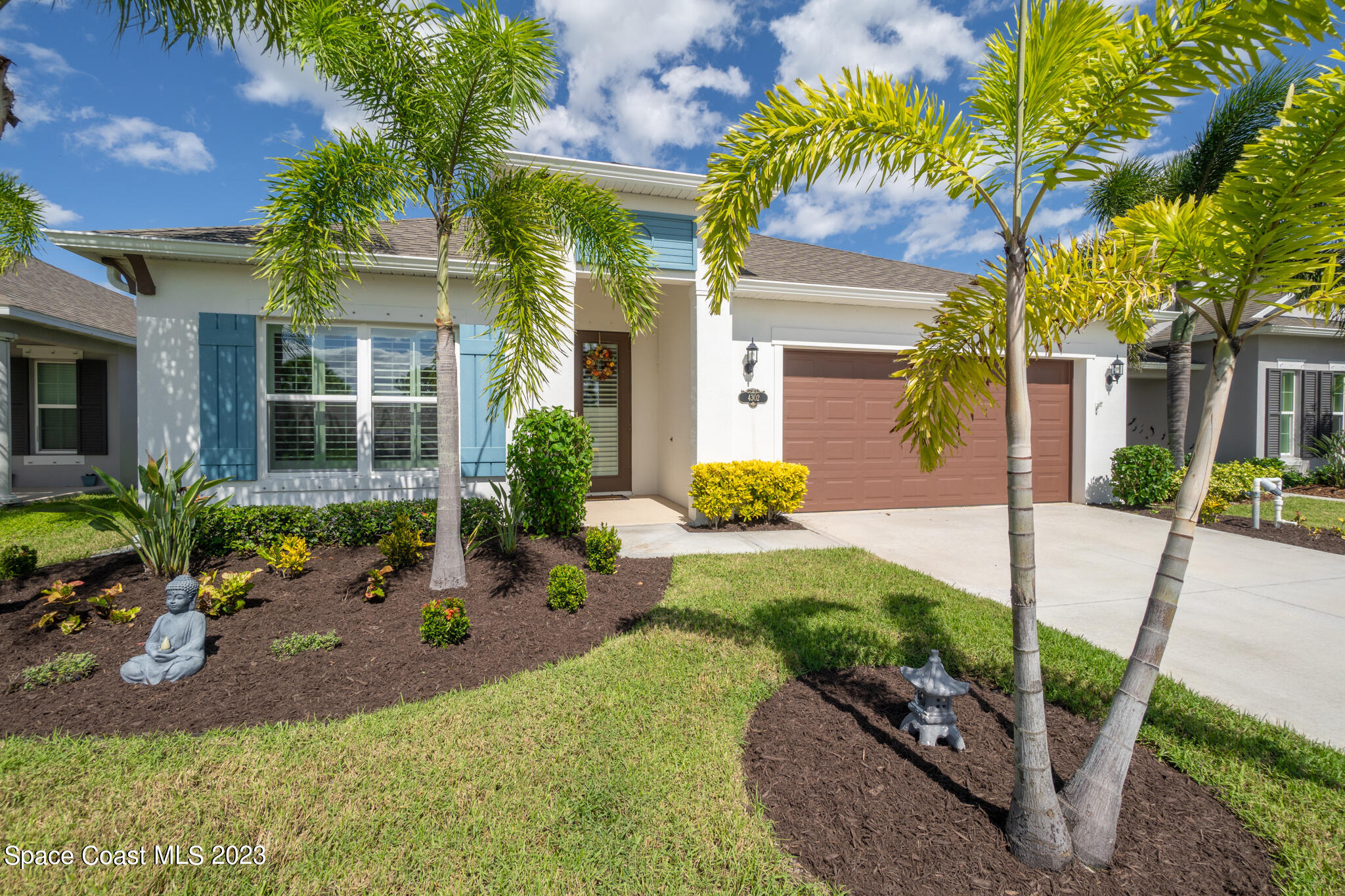 4302 Ruthann Circle Melbourne, FL 32934 - Photo 2 of 45 a front view of a house with garden