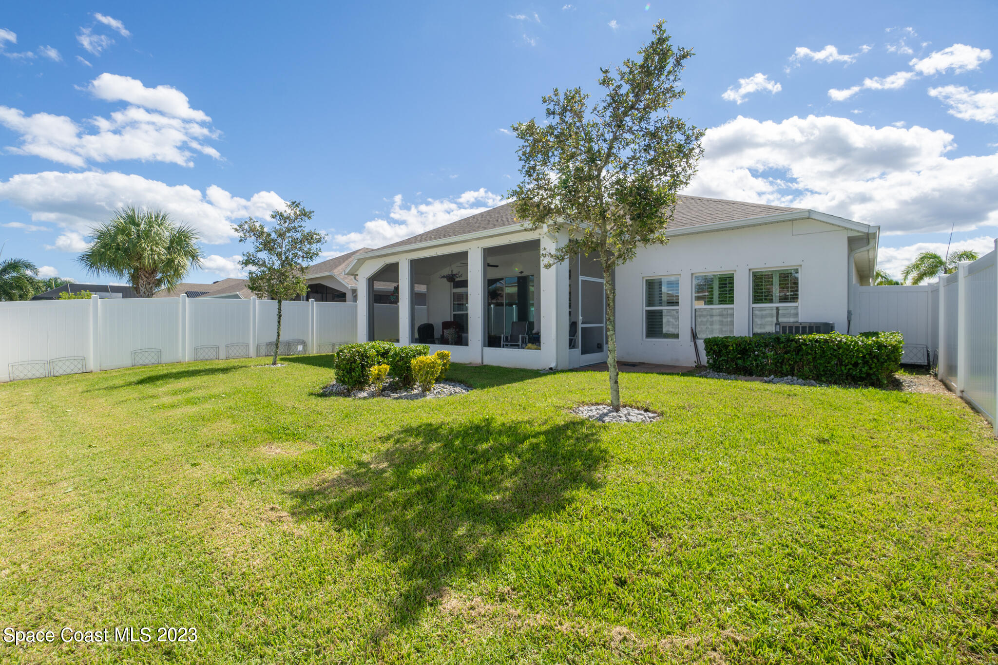 4302 Ruthann Circle Melbourne, FL 32934 - Photo 22 of 45 a view of a house with pool and a yard