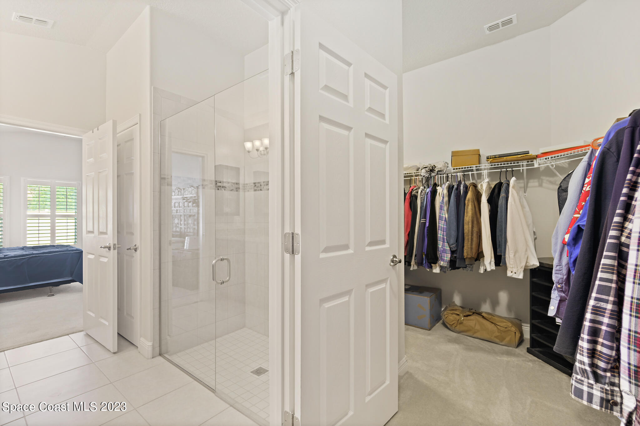 4302 Ruthann Circle Melbourne, FL 32934 - Photo 29 of 45 a view of walk in closet with clothes