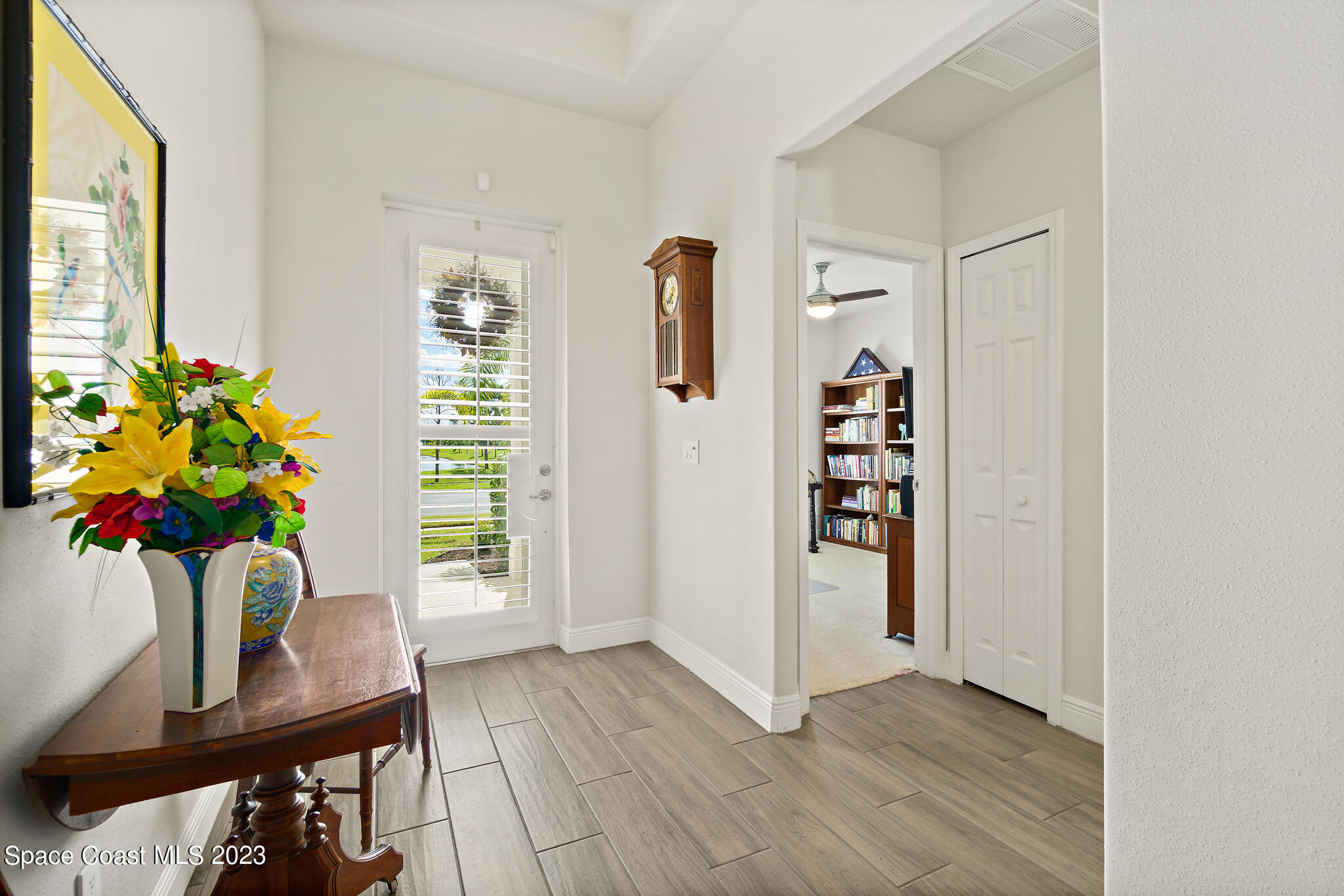 4302 Ruthann Circle Melbourne, FL 32934 - Photo 3 of 45 a view of an entryway with wooden floor