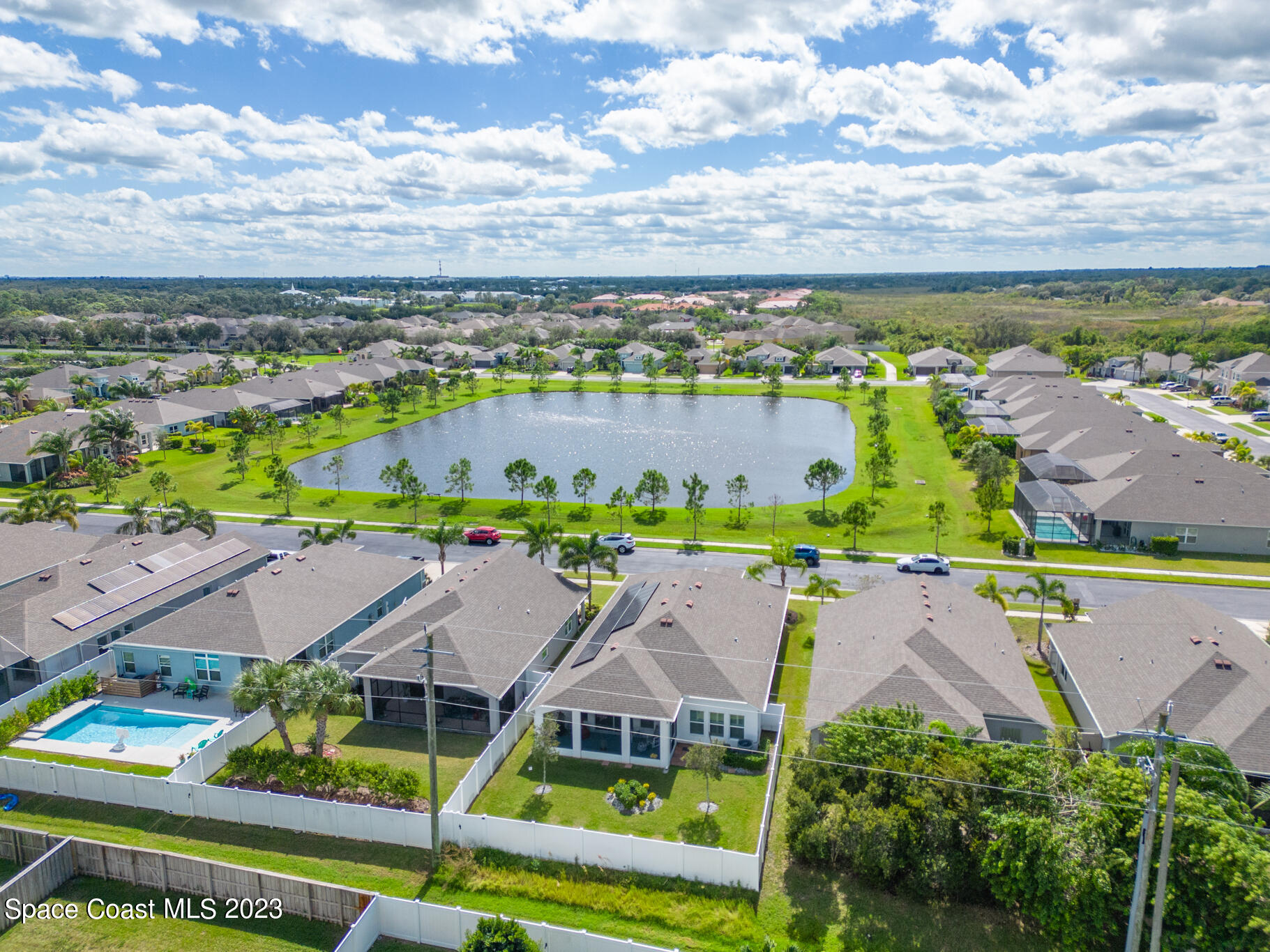 4302 Ruthann Circle Melbourne, FL 32934 - Photo 42 of 45 an aerial view of residential houses with outdoor space and swimming pool