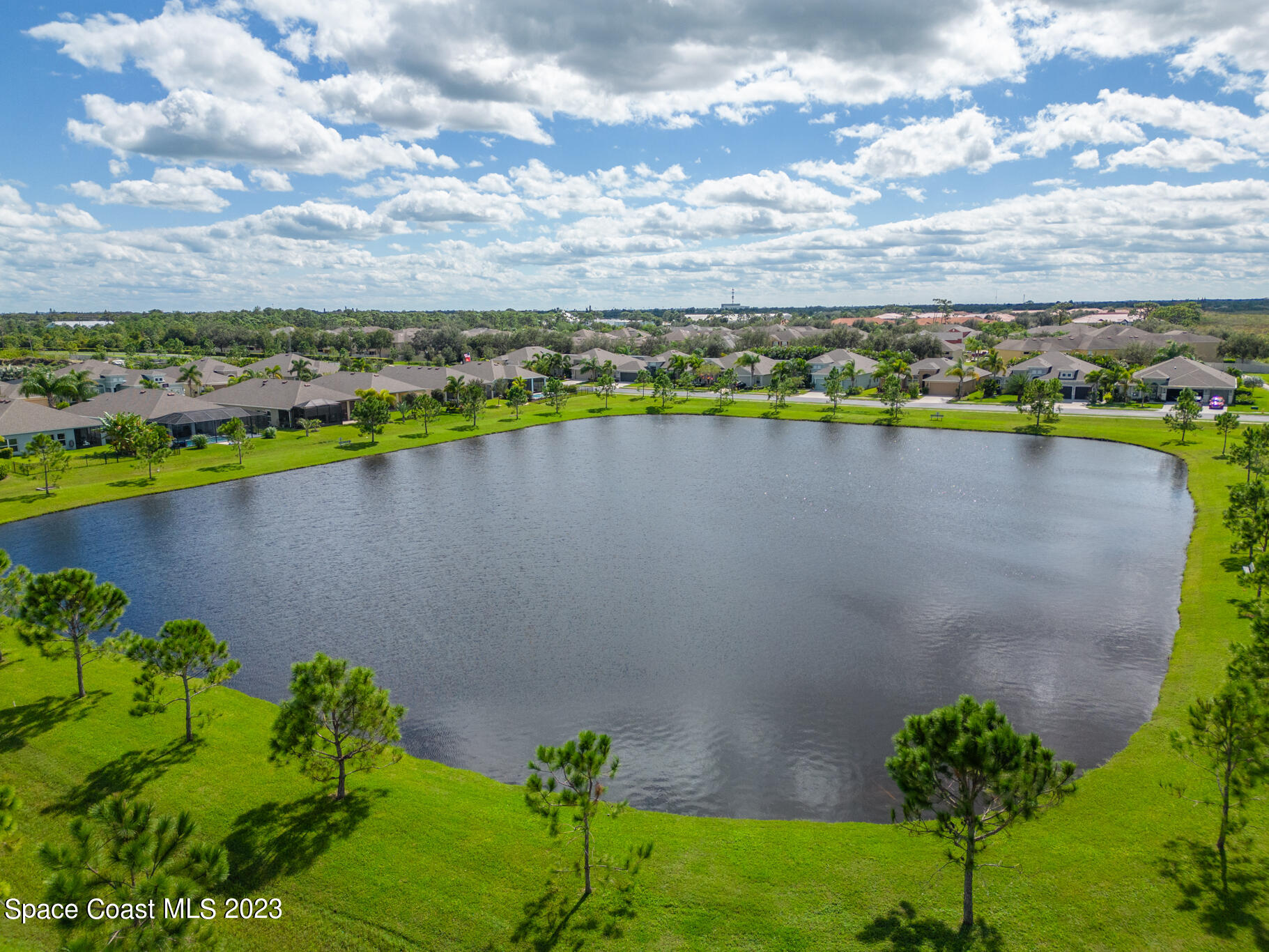 4302 Ruthann Circle Melbourne, FL 32934 - Photo 44 of 45 a view of a lake with a houses