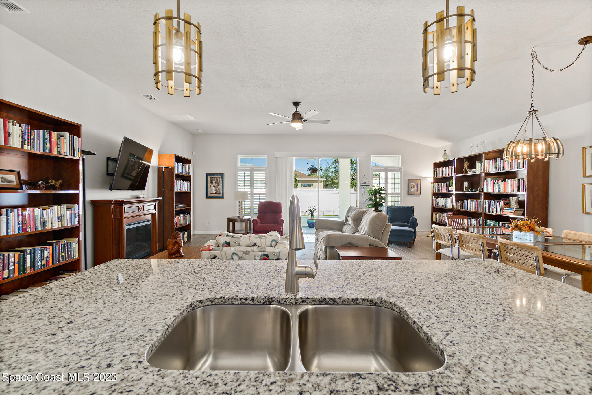 4302 Ruthann Circle Melbourne, FL 32934 - Photo 9 of 45 a kitchen with a sink a counter and cabinets