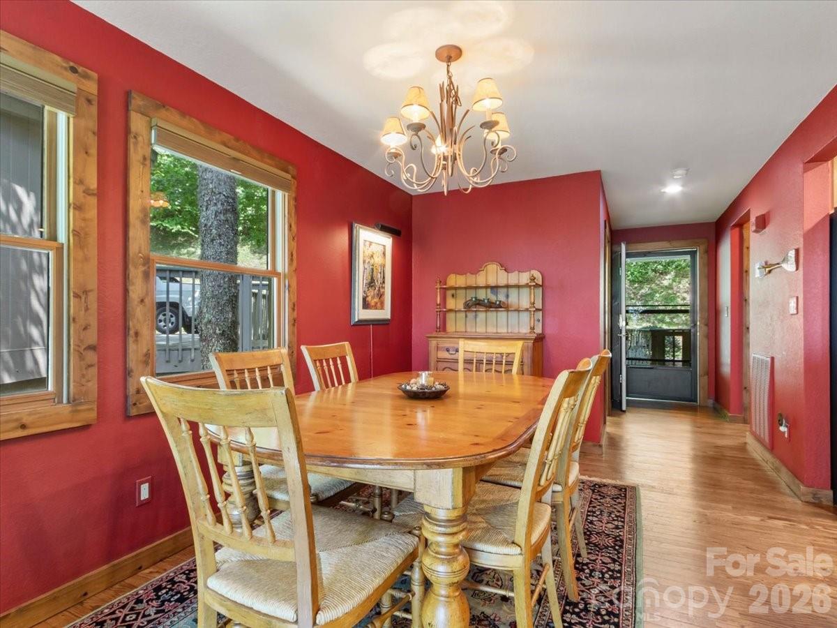 121 Ivy Ridge Road Burnsville, NC 28714 - Photo 15 of 48 a view of a dining room with furniture window and outside view