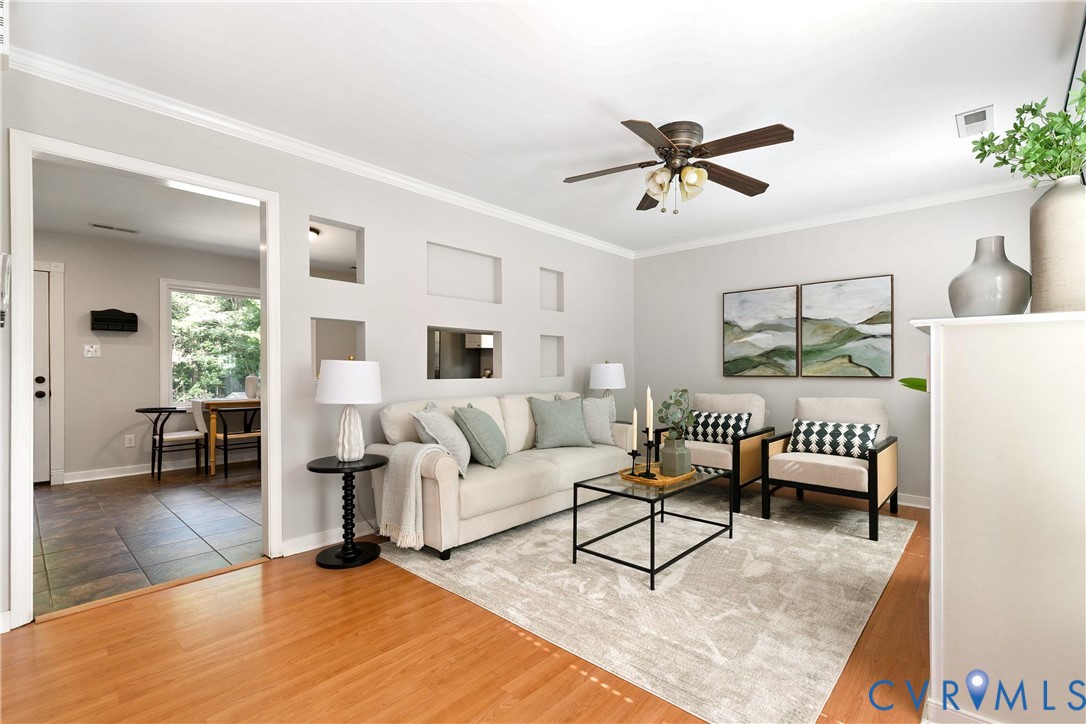 Bright, open living room featuring warm wood-finis