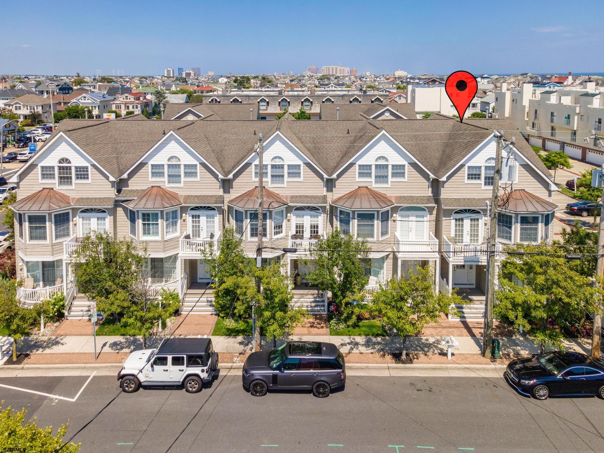 a view of multiple houses with a street