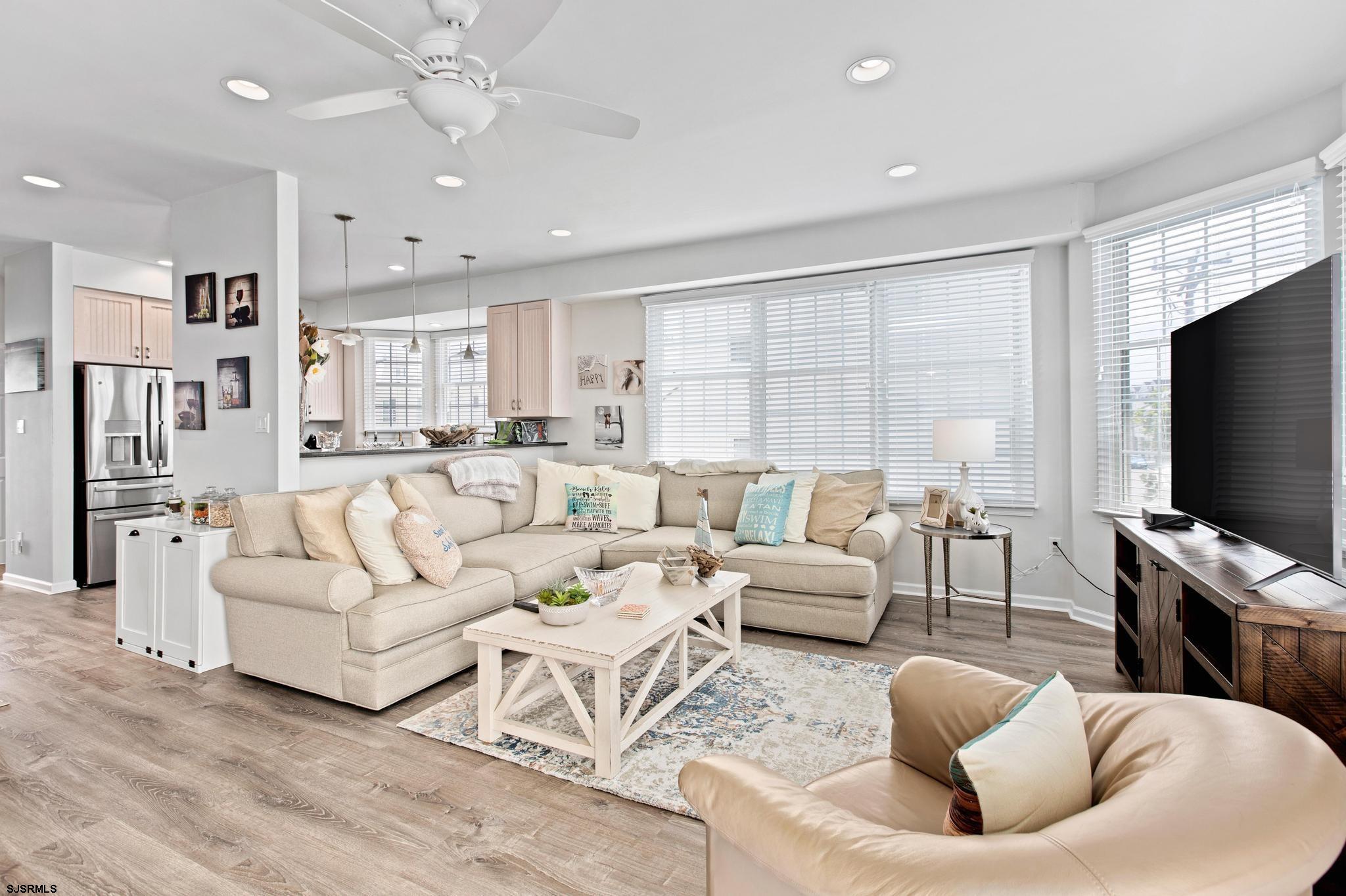 1 South Douglas Avenue, Unit 1 Margate City, NJ 08402 - Photo 16 of 48 a living room with furniture and a flat screen tv