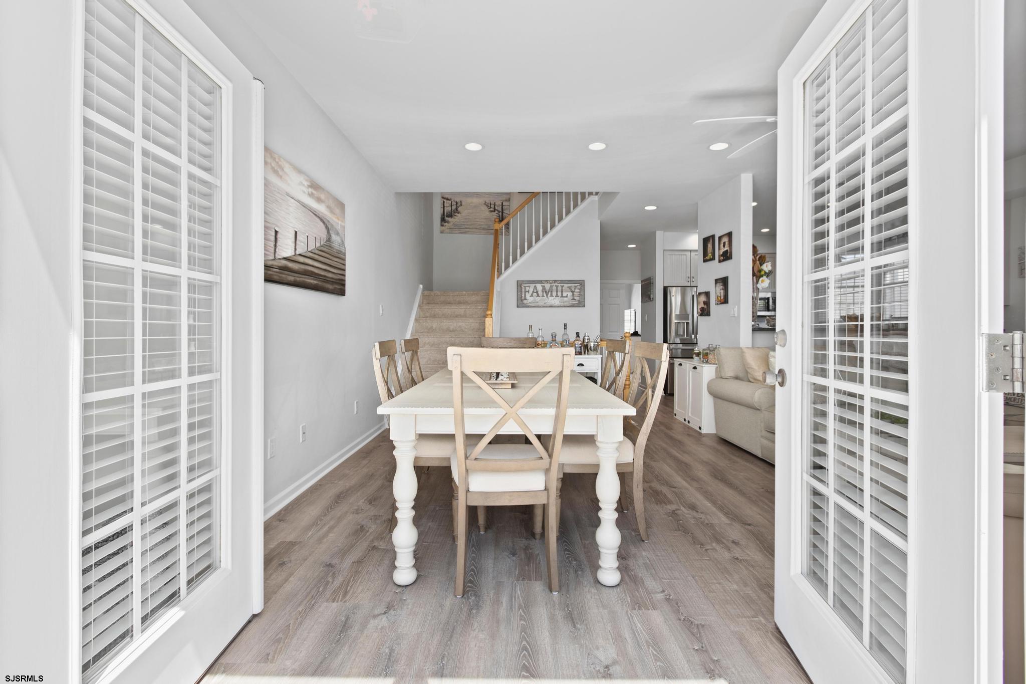 1 South Douglas Avenue, Unit 1 Margate City, NJ 08402 - Photo 24 of 48 a dining room with furniture and wooden floor