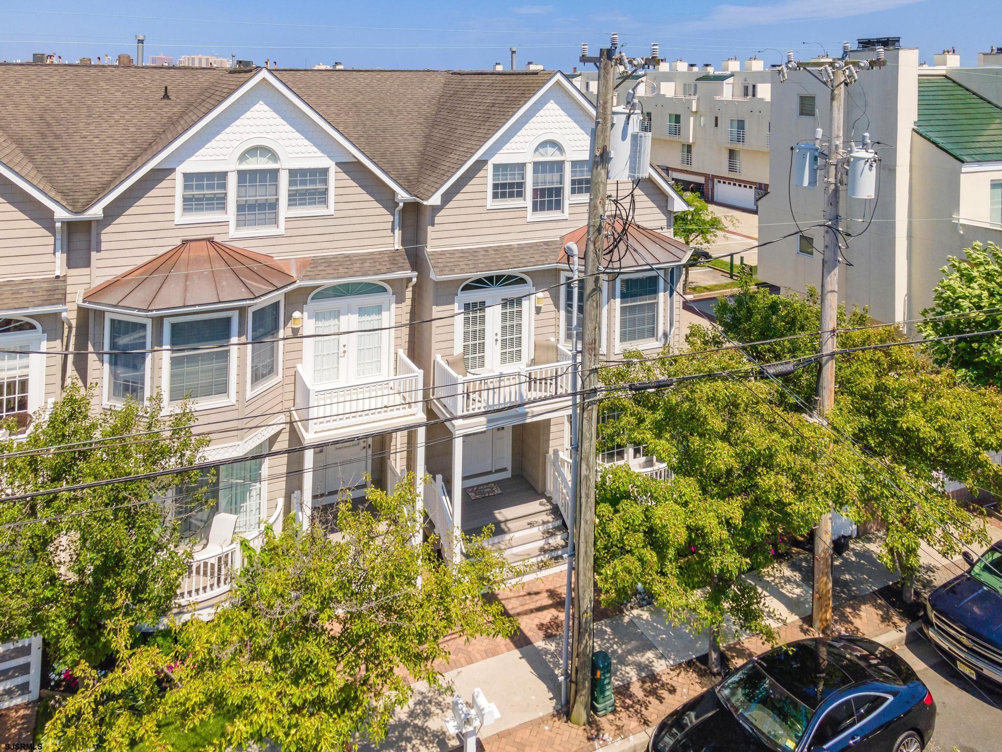 1 South Douglas Avenue, Unit 1 Margate City, NJ 08402 - Photo 3 of 48 a view of a white house next to a yard