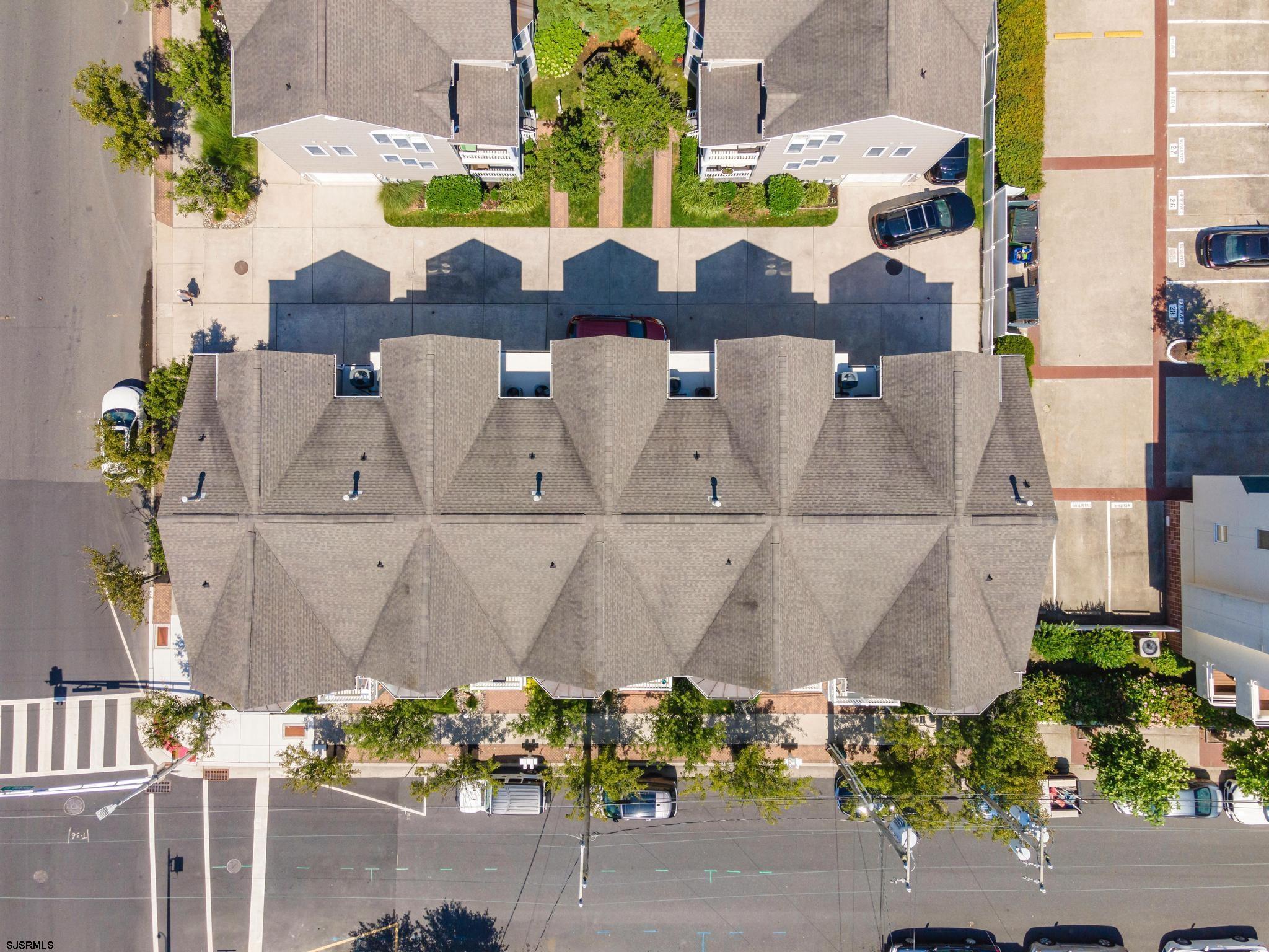 1 South Douglas Avenue, Unit 1 Margate City, NJ 08402 - Photo 39 of 48 an aerial view of a house with a garden and pool