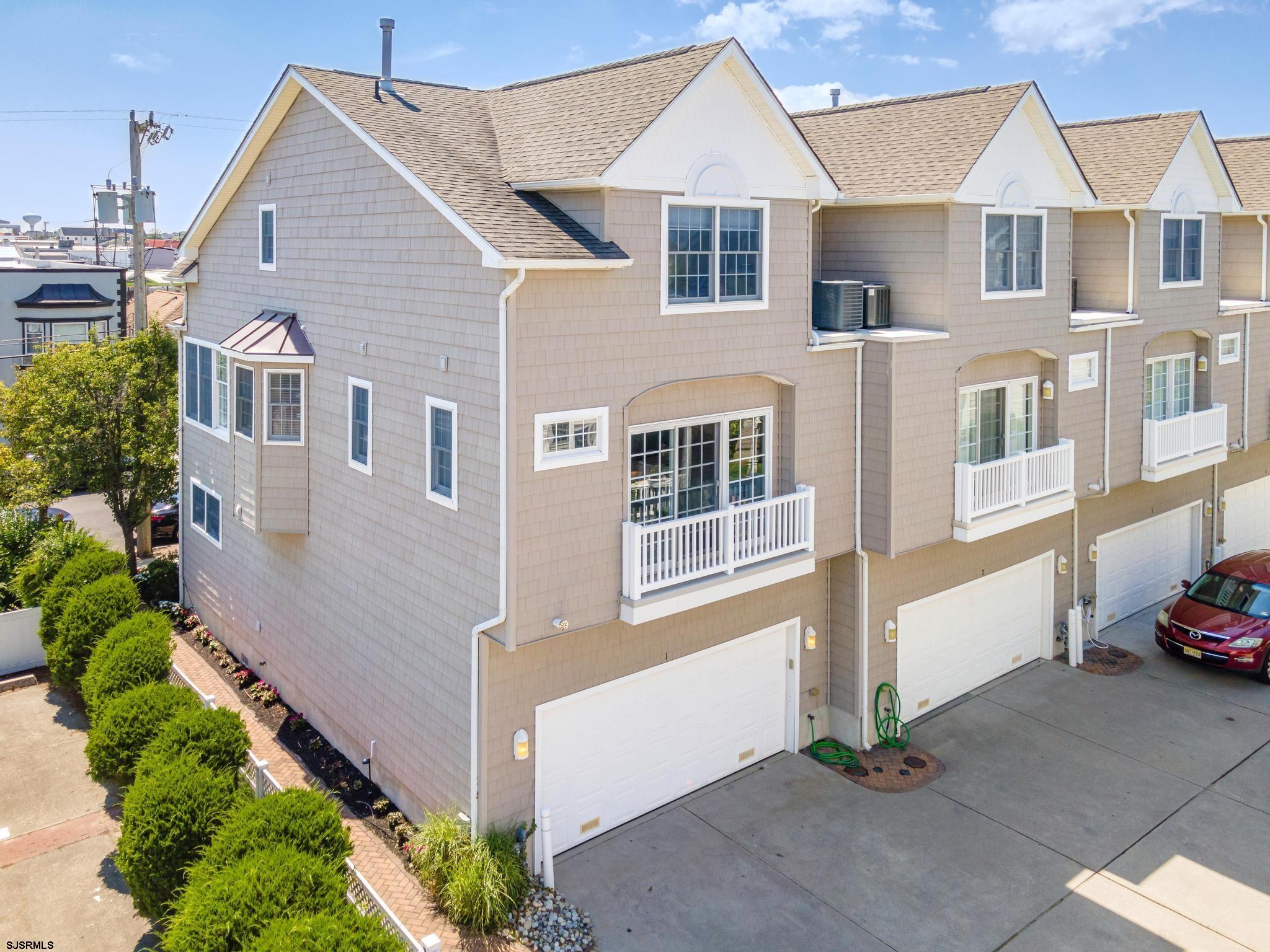 1 South Douglas Avenue, Unit 1 Margate City, NJ 08402 - Photo 44 of 48 a front view of a house with a yard