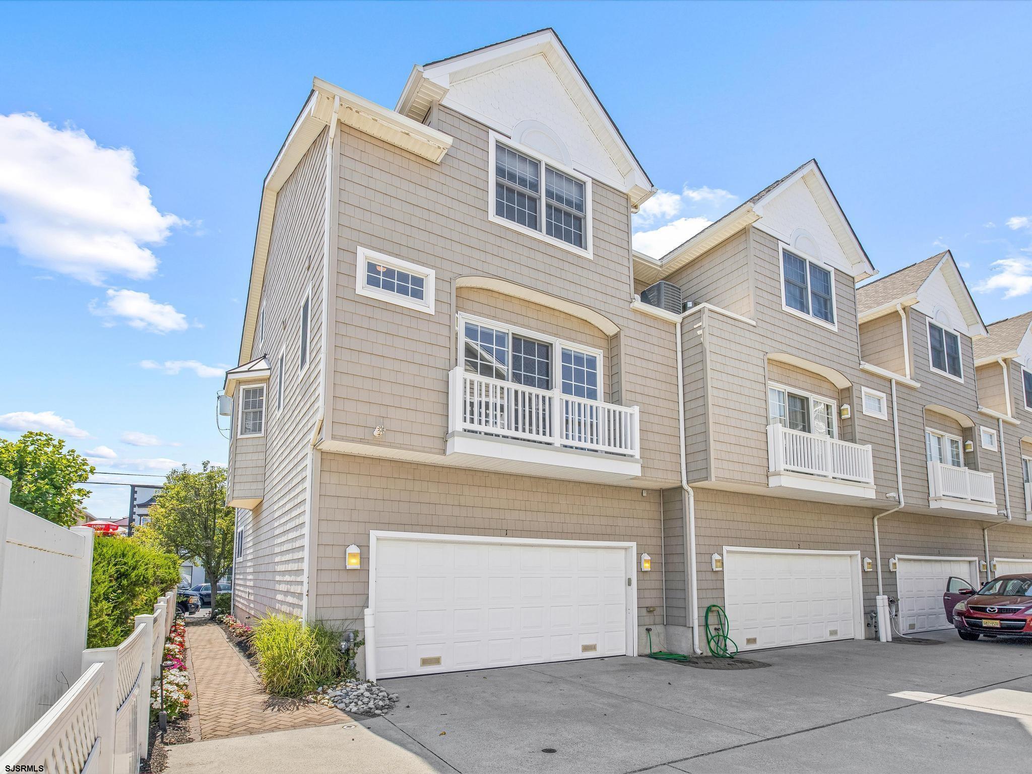 1 South Douglas Avenue, Unit 1 Margate City, NJ 08402 - Photo 45 of 48 a front view of a house with a garage