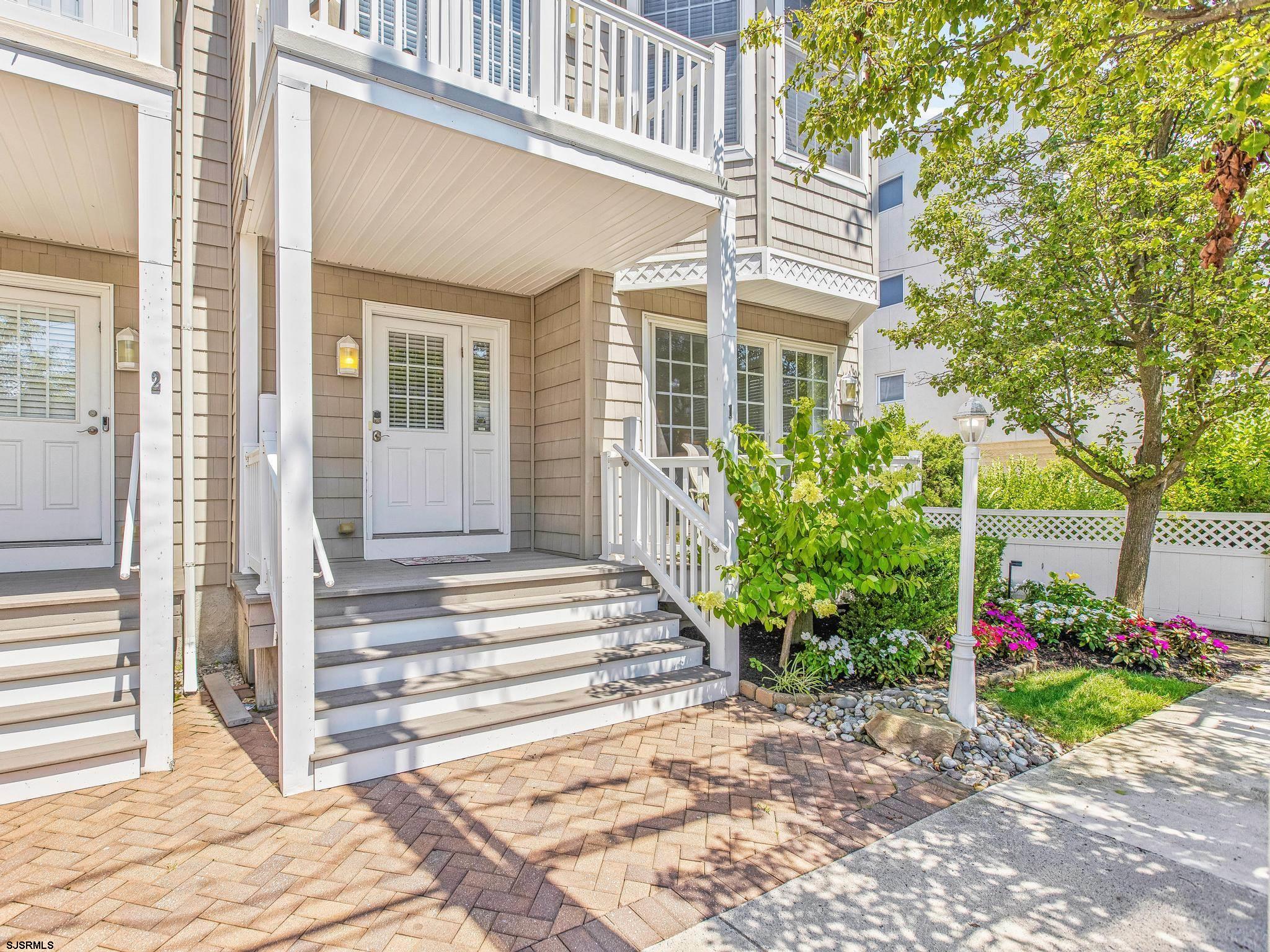 1 South Douglas Avenue, Unit 1 Margate City, NJ 08402 - Photo 7 of 48 a front view of a house with garden