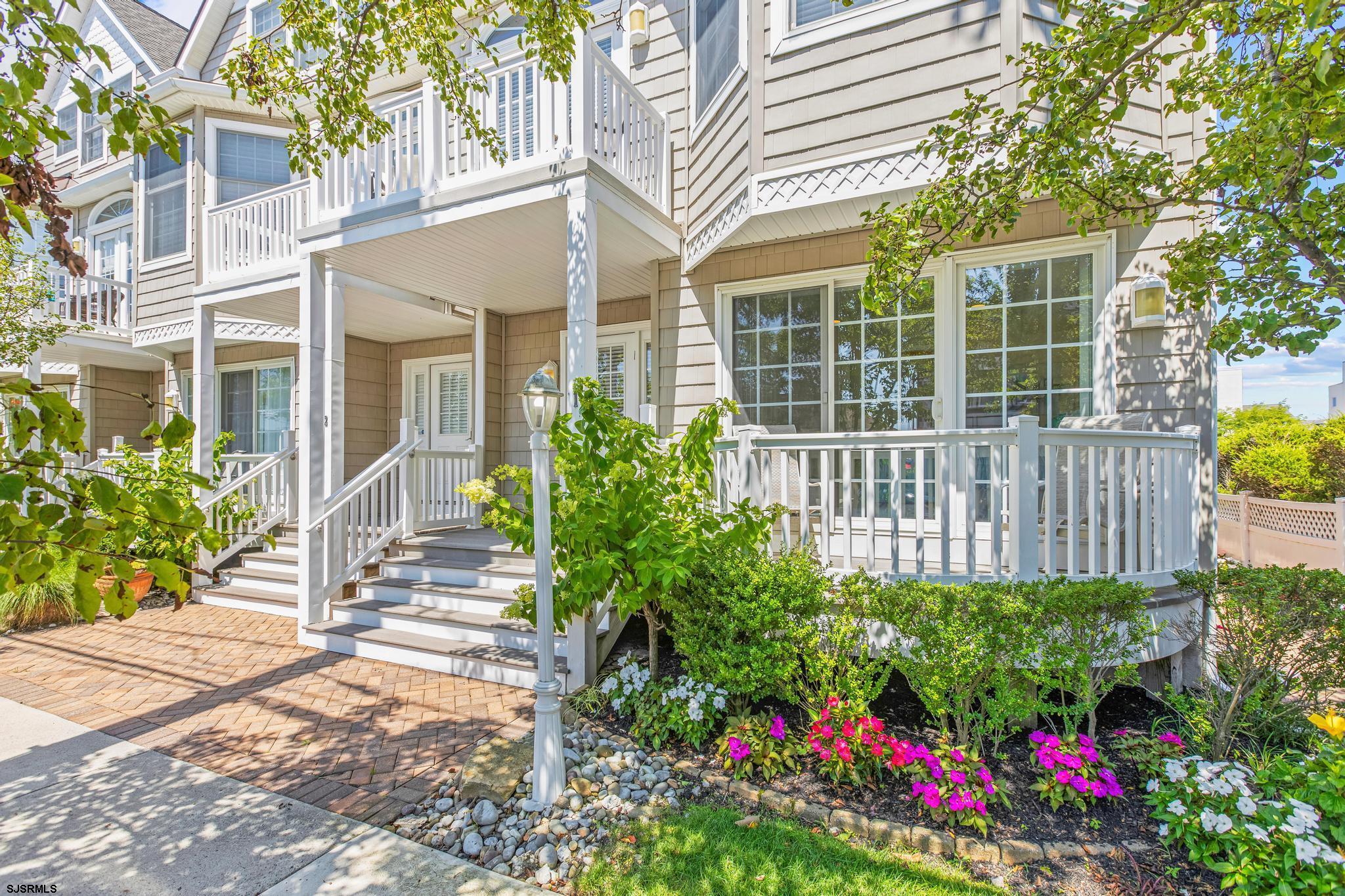 1 South Douglas Avenue, Unit 1 Margate City, NJ 08402 - Photo 8 of 48 a view of a house that has a flower garden