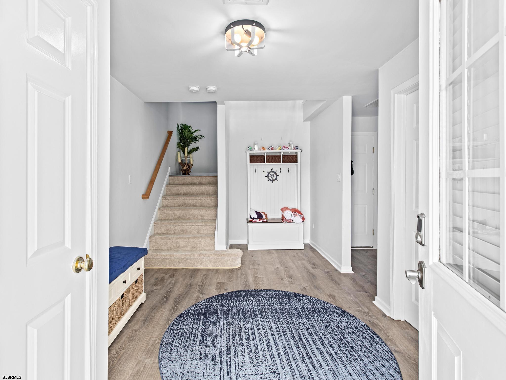 1 South Douglas Avenue, Unit 1 Margate City, NJ 08402 - Photo 9 of 48 a view of entryway and hall with wooden floor