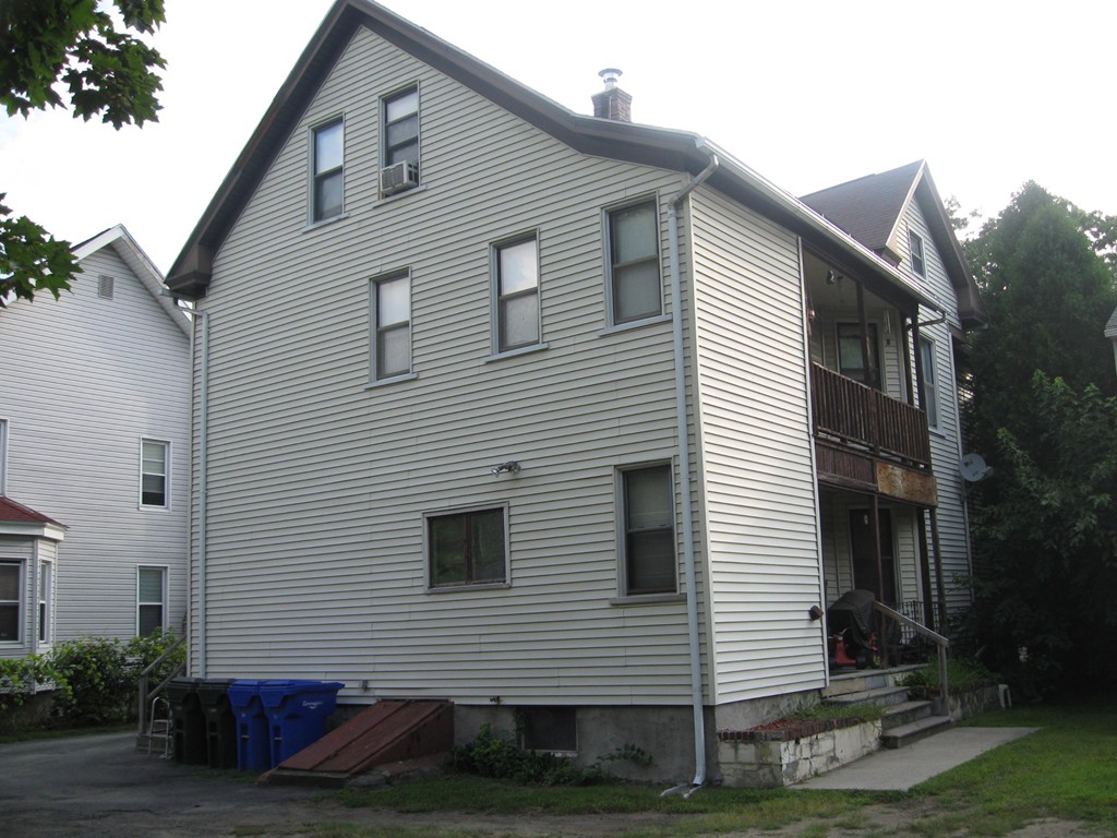 288-290 Oak Street Springfield, MA 01151 - Photo 3 of 18 a front view of a house with a yard