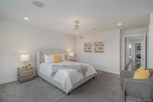 a bedroom with bed and a couch