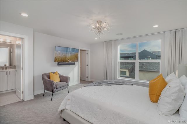 a bed room with furniture and a window