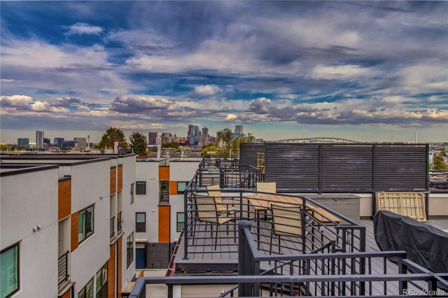 a view of a balcony with city view
