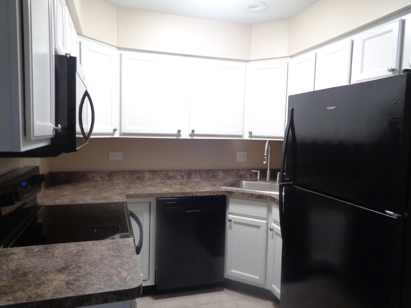 10442 Brooks Lane, Unit C1 Chicago Ridge, IL 60415 - Photo 4 of 12 a kitchen with a sink and a refrigerator