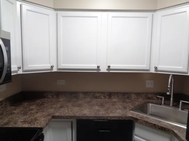 a kitchen with a sink and a window