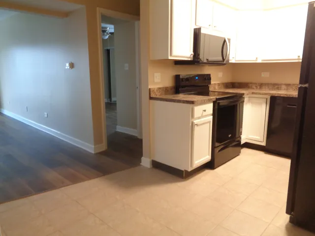 a kitchen with a stove and a microwave