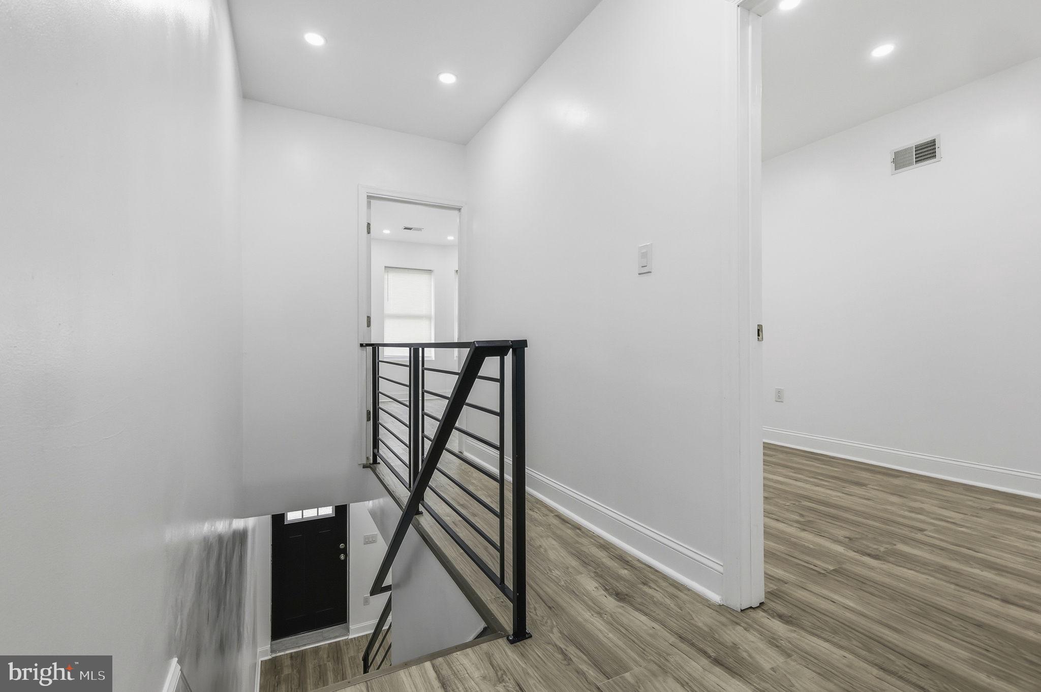 5542 Pemberton Street Philadelphia, PA 19143 - Photo 11 of 22 a view of a hallway with wooden floor