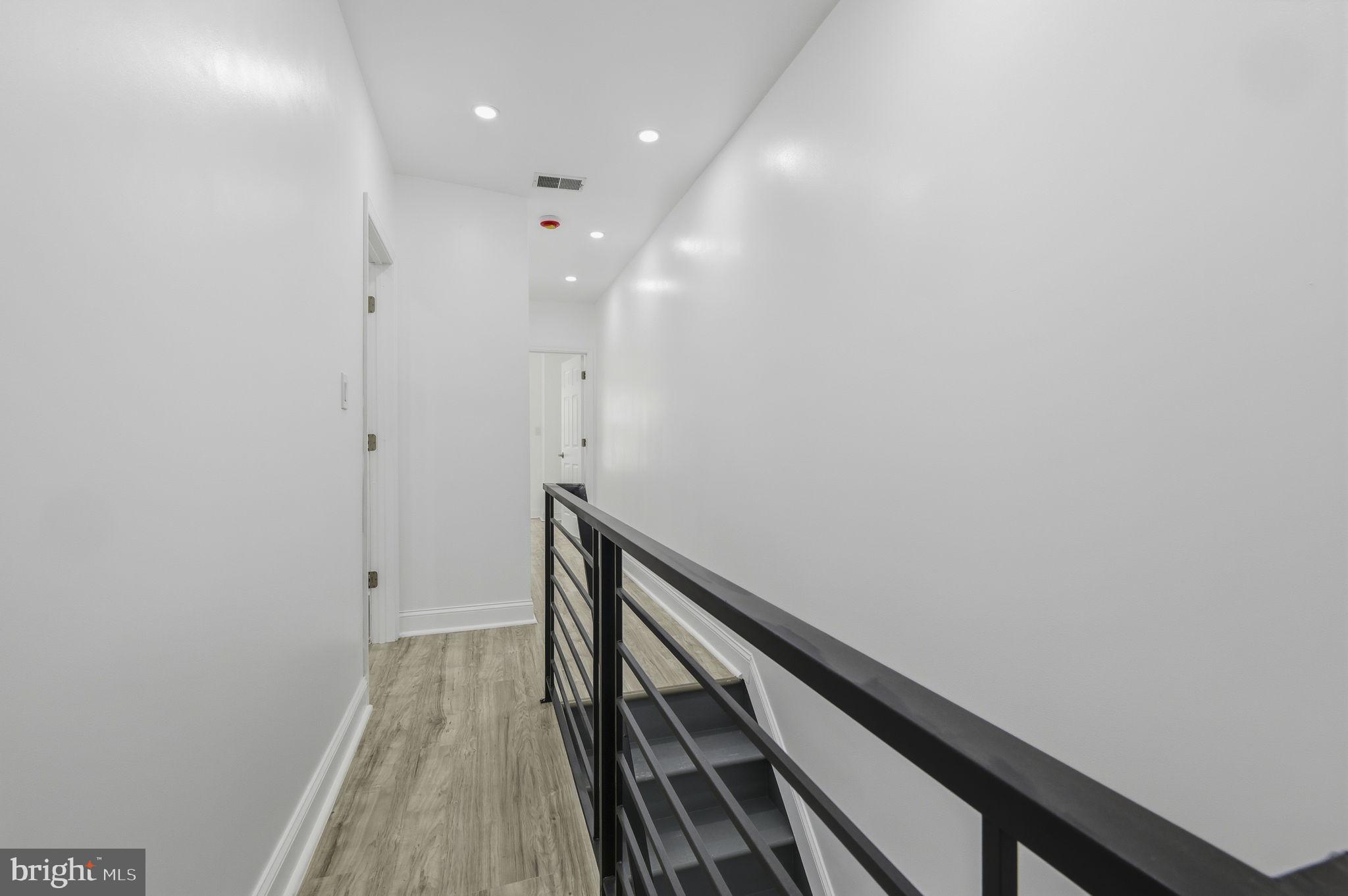 5542 Pemberton Street Philadelphia, PA 19143 - Photo 13 of 22 a view of hallway with wooden floor