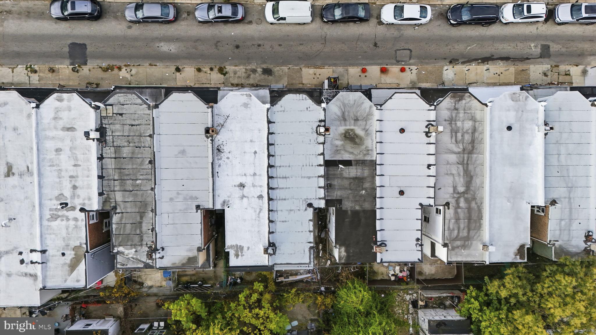 5542 Pemberton Street Philadelphia, PA 19143 - Photo 21 of 22 an aerial view of a residential apartment building with a yard