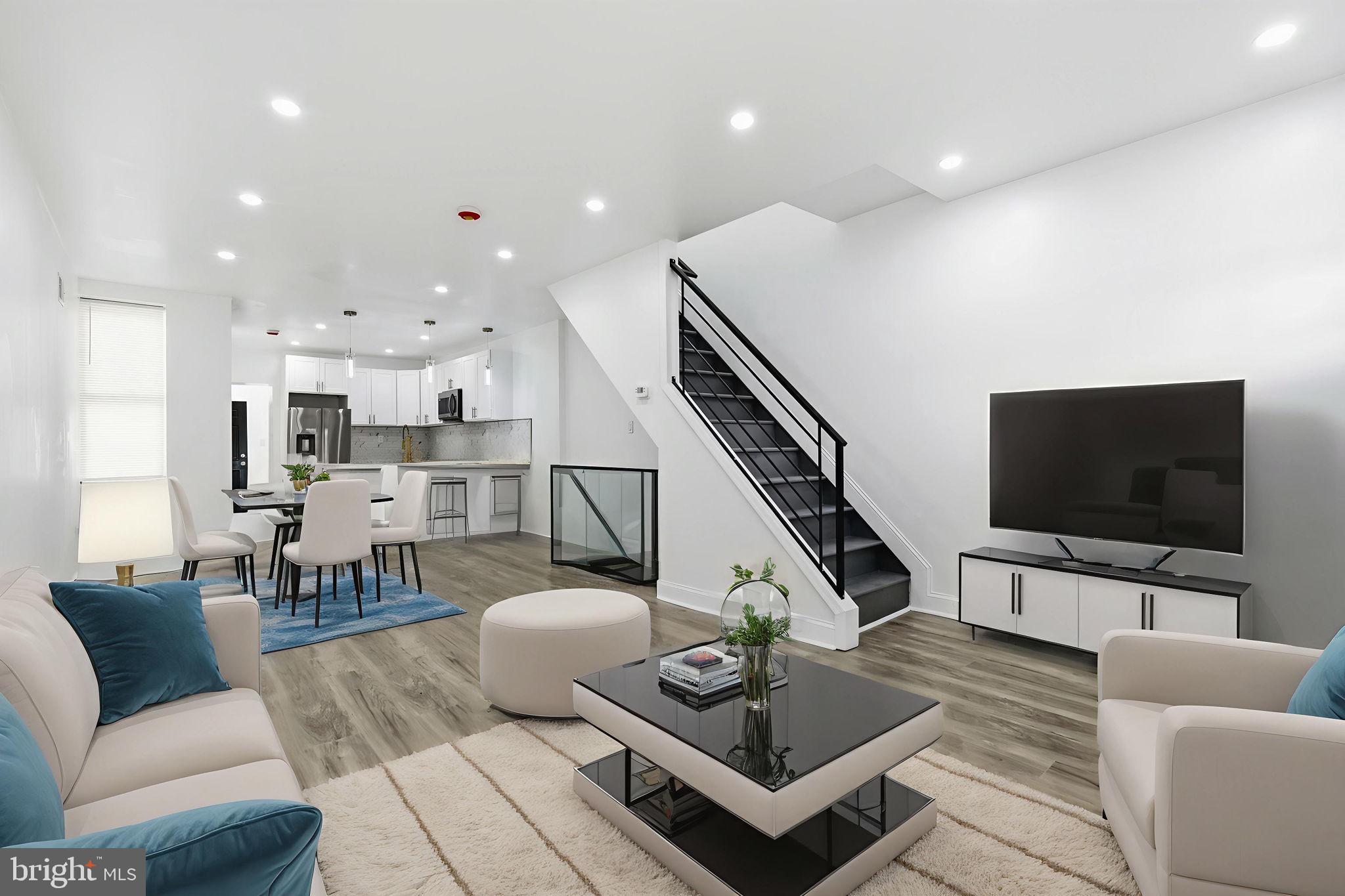 5542 Pemberton Street Philadelphia, PA 19143 - Photo 5 of 22 a living room with furniture and a flat screen tv