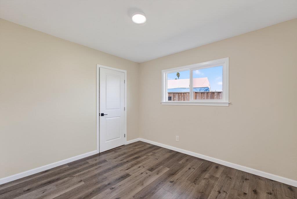 136 Lester Court Watsonville, CA 95076 - Photo 11 of 32 a view of empty room with wooden floor