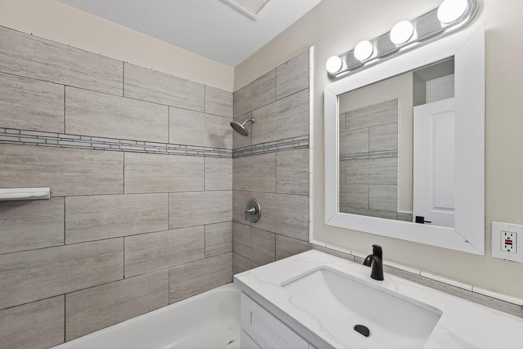 136 Lester Court Watsonville, CA 95076 - Photo 12 of 32 a bathroom with a sink and shower