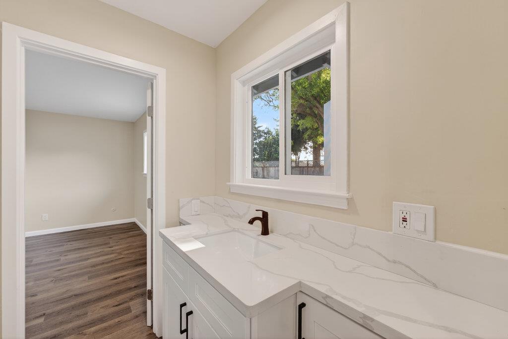 136 Lester Court Watsonville, CA 95076 - Photo 14 of 32 a bathroom with a sink and a window