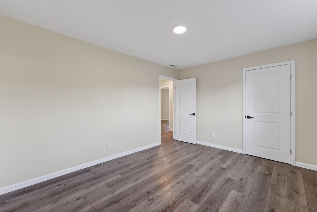 136 Lester Court Watsonville, CA 95076 - Photo 16 of 32 a view of an empty room with wooden floor