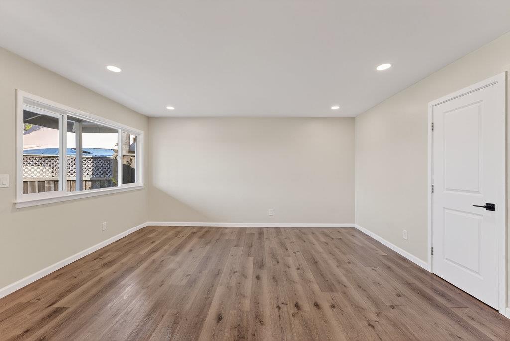 136 Lester Court Watsonville, CA 95076 - Photo 6 of 32 a view of empty room with wooden floor and fan