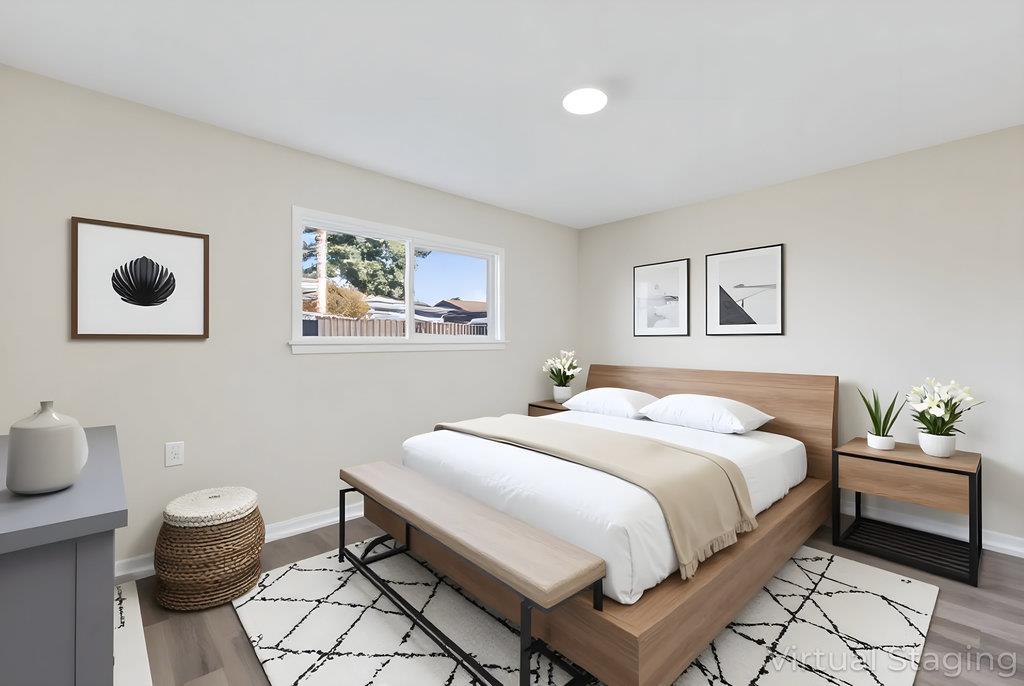 136 Lester Court Watsonville, CA 95076 - Photo 9 of 32 a bedroom with a bed and a painting on the wall