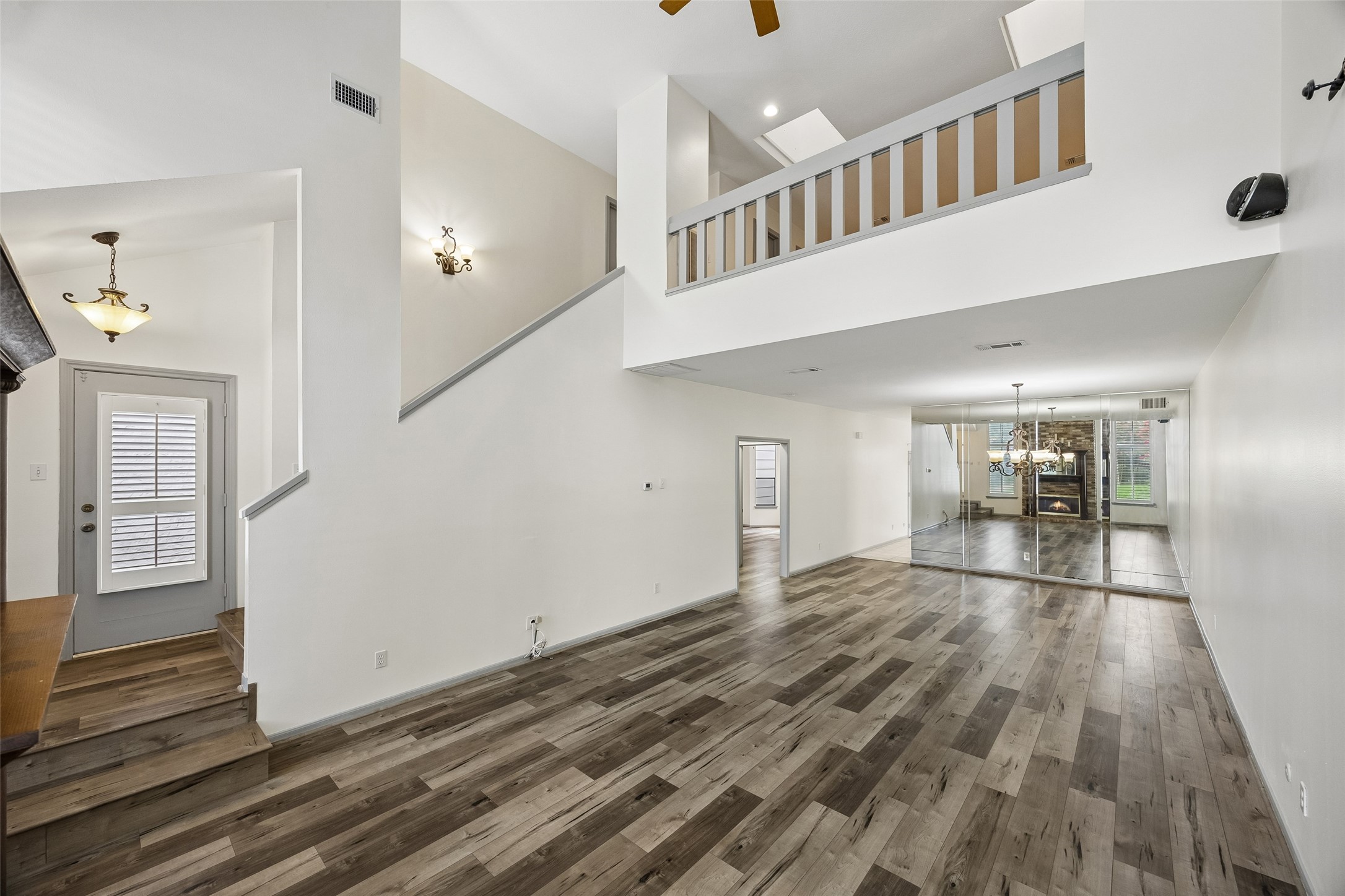 727 Bunker Hill Road, Unit 92 Houston, TX 77024 - Photo 4 of 50 RICH TONED VINYL PLANK & TILE FLOORING RUN THROUGHOUT THIS HOME, KEEPING ITS INTERIOR COMPLETELY CARPET- FREE.