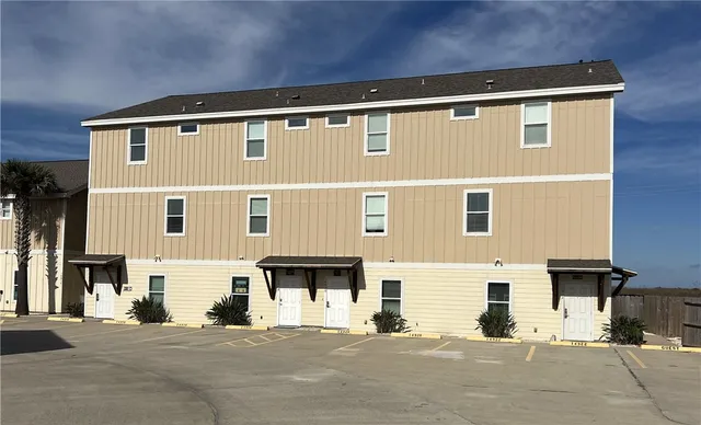 a front view of a building with a road
