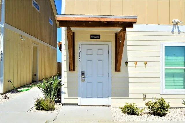 a front view of a house with a garage