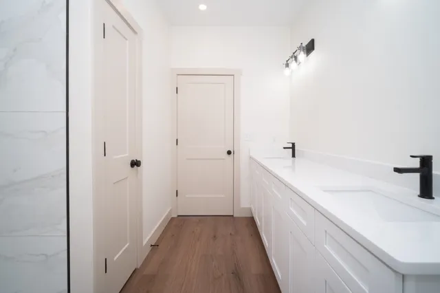 a bathroom with a bathtub and a sink