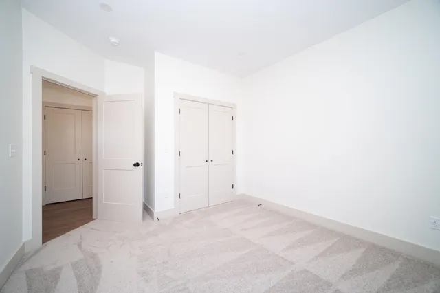 a bathroom with a granite countertop sink a toilet and a bathtub